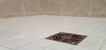 Photos by JAS Remodeling Inc #2 R&R shower pan. Replace plywood sub flooring under pan. Re-tile shower. Install new frameless shower, tub and shower fa
