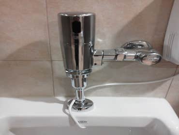 Urinal flush valve install.