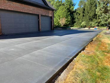 Photos by Guevara Alexander #1 A curated collection of our high-end residential concrete work, including stamped patios, exposed aggregate driveways, w