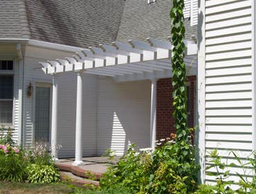 (2) Custom designed timber-framed pergola, timber-framed carport Each timber is hand carved to fit into the joining beam.