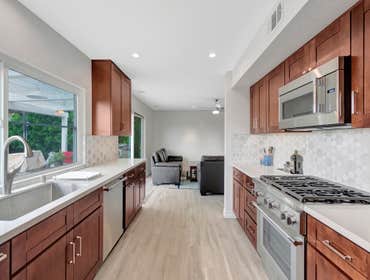 Kitchen Remodel We installed a unique marble design backsplash, which adds sophistication and character, along with a durable and stylish quartz counte