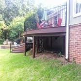 Project photos from Erskine Martin Homes & Renovations Radius front ipe (Brazilian ironwood) deck with radius curved wrought iron railings and radius i