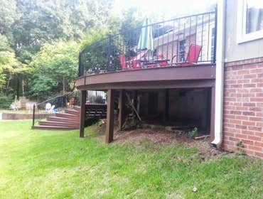 Project photos from Erskine Martin Homes & Renovations Radius front ipe (Brazilian ironwood) deck with radius curved wrought iron railings and radius i