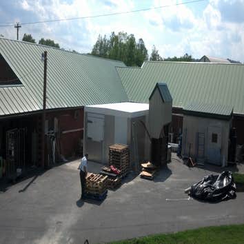 Photos from Fishers Country Store Tapered roof system on freezer. Conklin Benchply
