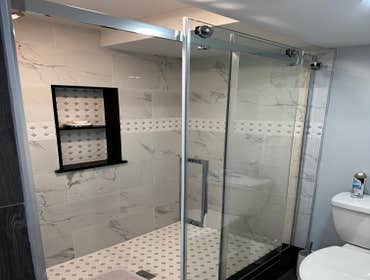 Photos by Eagle Construction & Remodeling Corp #1 Finish basement with a bathroom
