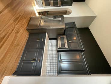 Photos by Austin Fine Finish Painting LLC #1 46 Piece Cabinet repaint. Benjamin Moore Satin Impervo color matched to SW Tricorn Black. Photos taken d