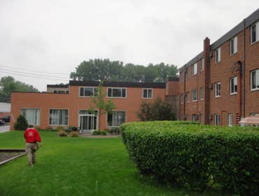 Centennial Commons Apartments in Roseville Asphalt shingle and ballasted torch down re-roof, siding, guttering, skylights, framing, and custom window w