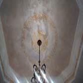 Plaster and gold medallion