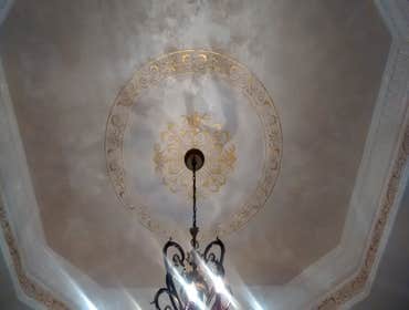 Plaster and gold medallion