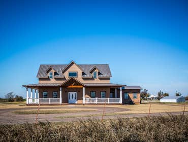 Ranch Road Ranch Road is a design that originated on an open rural site. Located west of Calumet, Oklahoma the site is situated next to a lake with a s