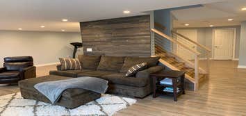Custom Basement Remodel 1 Finishing of a basement. Install bathroom. Custom cabinets and wood installation on walls.