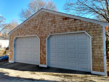 Full Garage remodel - Medfield MA On this project we replaced the siding, roofing. And built a storage inside the garage.