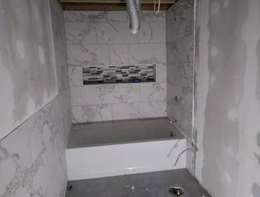 Photos by Desousa Construction and Remodeling #1 All new marble bathroom