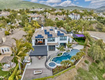 PANORAMIC VIEWS OF LA COSTA Step into the epitome of luxurious living in this stunning 6 bedroom, 5 bath home located in the sought-after Carlsbad comm