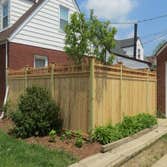 Cedar Fence with Arbor.