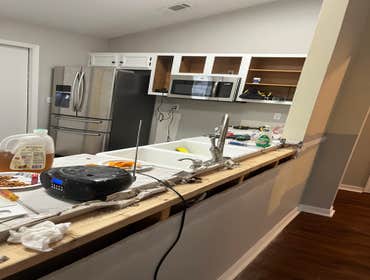 Photos by Tropical Building & Remodeling Inc #1 Completely removed old kitchen and end pony wall. Cut down pony wall to cabinet height and installed ro