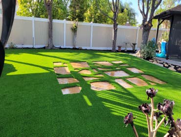 Photos by Jz Synthetic Products #3 Flagstone, with beautiful turf all around..
A great flagstone install with some high quality turf to add to its beau