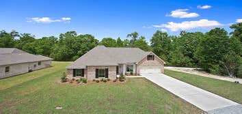 Photo(s) from Jenkins Homes, Inc. A 4 bedroom, 3 bathroom home nestled up to a beautiful dedicated green space in Covington, LA. This home has a spit f
