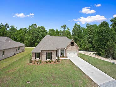 Photo(s) from Jenkins Homes, Inc. A 4 bedroom, 3 bathroom home nestled up to a beautiful dedicated green space in Covington, LA. This home has a spit f