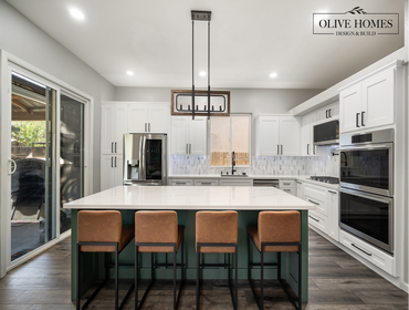 Two-Tone Kitchen: Sage Island & Farmhouse Accents in Lincoln, CA 95648 This kitchen remodel beautifully blends transitional styling with a bold, two-to