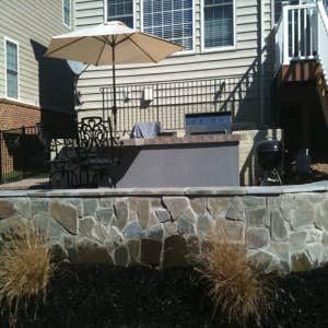Paver Patio and Walkway This is a a combination of some of our work. Landscaping box and Veneer retaining wall, walkway and flagstone patio.