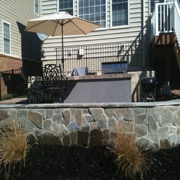 Paver Patio and Walkway This is a a combination of some of our work. Landscaping box and Veneer retaining wall, walkway and flagstone patio.