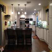 Q Kitchen We combined the kitchen and dining room to create one longer, better designed space for this family.