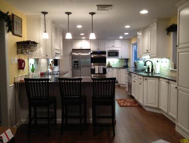 Q Kitchen We combined the kitchen and dining room to create one longer, better designed space for this family.