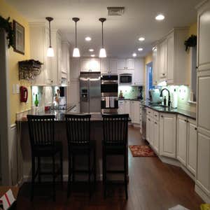 Q Kitchen We combined the kitchen and dining room to create one longer, better designed space for this family.