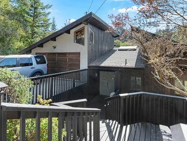 Smooth Stucco, Wood Siding, Deck, Roof & Driveway