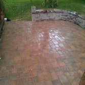 Patio and Wall This is a patio and wall that was built by Greenfield Lawncare and Landscaping.