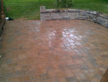 Patio and Wall This is a patio and wall that was built by Greenfield Lawncare and Landscaping.