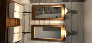 Photos by Elite Building and Remodeling #1 Rustic Bathroom
