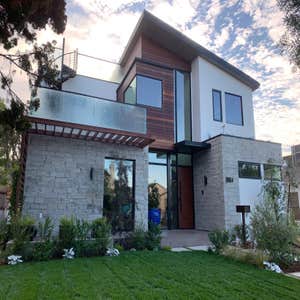 Front Facade, Stone, Ipe cladding, Western Windows and doors