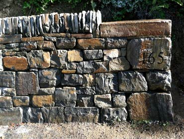 Dry Stone Walling project of Borrowed Ground Each dry stone walling project is built by professional dry stone masons. We specialize in building high q