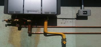 On -Demand water heater install ( Ours vs. Theirs ) Removal of tank-type water heater, run copper lines and electrical supply from attic, resize gas su