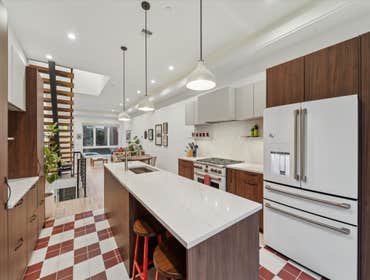 Open Plan Kitchen by NK Construction and Design Inc For this project, the goal was to create an open and inviting space that seamlessly connects the ki