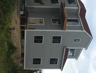 West Boxford Old Barn Nobleport Construction 200 year old barn face lift cedar shingles and a window. Framing ect..