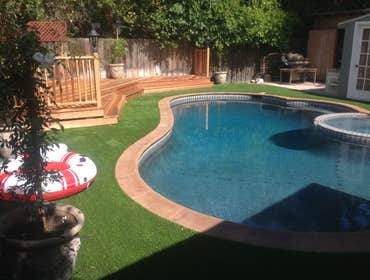 Redwood deck, turf, back yard.