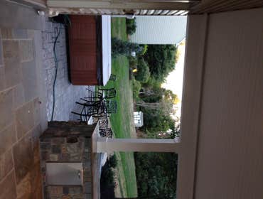 Outdoor kitchen/ sitting area This was a outdoor pavillion on the back of the homeowners house with a grilling area a fire place and outdoor sitting ar