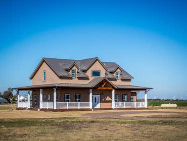 Ranch Road Ranch Road is a design that originated on an open rural site. Located west of Calumet, Oklahoma the site is situated next to a lake with a s