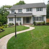 Hillsdale, NJ Complete Front Landscape Reno The stacked stone walls and slab steps replaced existing crumbling poured concrete walls, steps and walkway