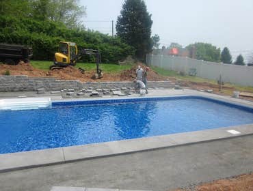 Photos by Dunn Landscape Construction #1 After initial pool installation provide all hardscape including retaining walls, pool deck, walkways and plant