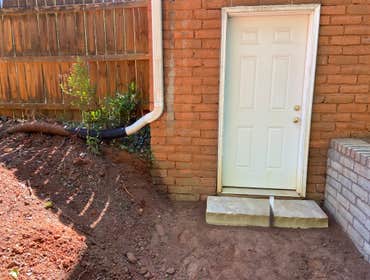 Make it nice and dry with steps and drains Grading solution. 'Positive drainage' is when you grade the soil so that water runs away from the house. W