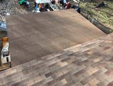 Flat roof tied into 3 tab roof