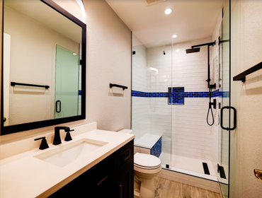 Photos by American Home Improvement #11 White Bathroom w/ Blue Tile Accents
