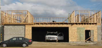 New Construction of 2 story house built using concrete blocks and wood framing