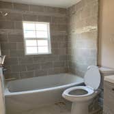 Photos by Head to Toe Home Improvement #4 We completely removed and replaced old bath tub, toilet, sink, vanity, tiles and floors with updated material