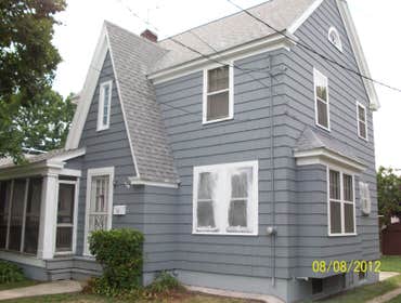 Brilliant Painting, LLC Exterior Project 1 Before and after photos of a full house that has been power washed, scraped, hand sanded, primed, and painte