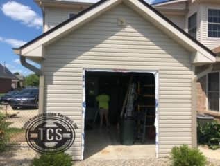 Photos by Tuttle Construction Services Inc #9 Porch was converted to storage garage.